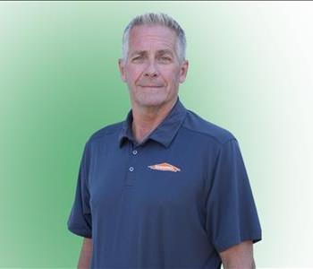 photo of a man in front of green background