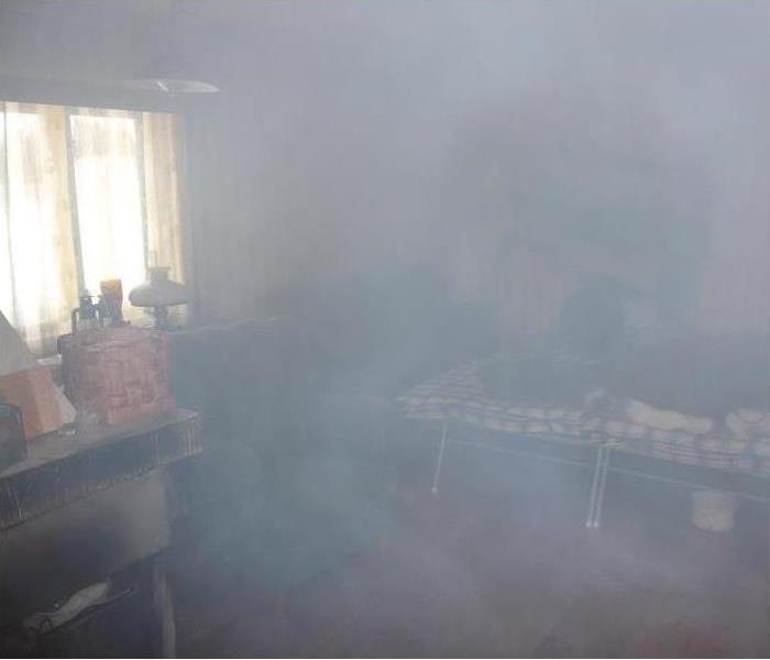 A smoke filled living room that has left behind an odor