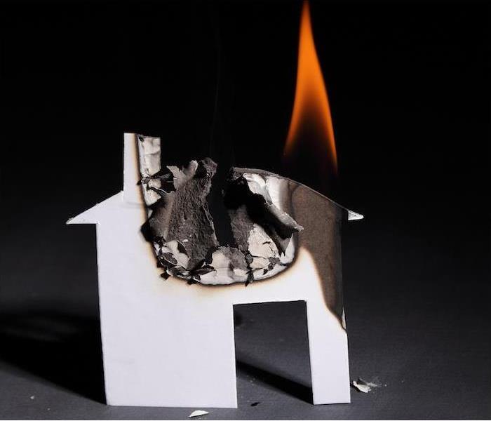paper.jpg” alt = “a small paper house burning